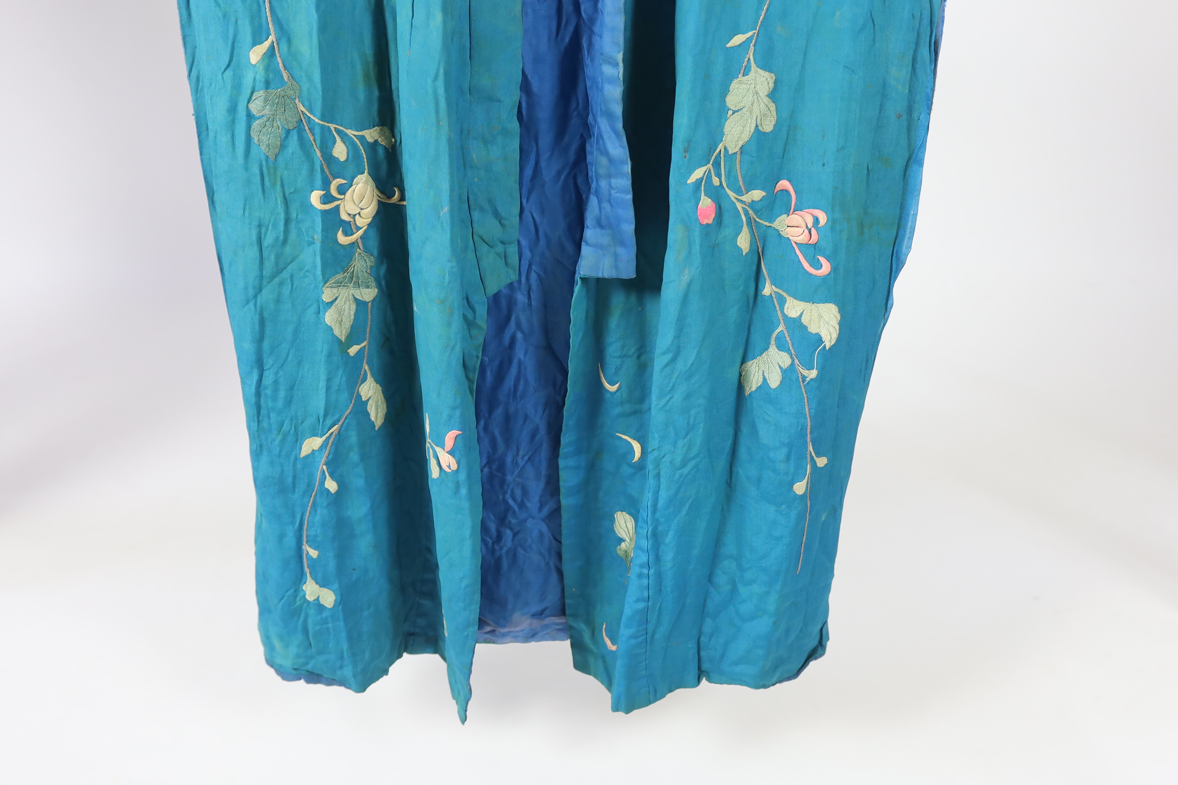 An early 20th century silk crêpe Japanese kimono and fringed tie belt, the back panel heavily embroidered with trailing chrysanthemum type flowers and leaves. This item is being sold for the back panel only and is with a